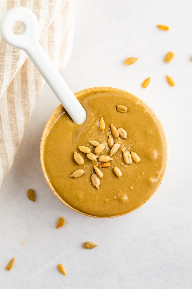Overhead photo of sunflower seed butter with a spoon.