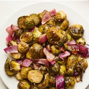 An overhead photo looking down on a plate of vinegar roasted Brussels sprouts.