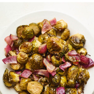 An overhead photo looking down on a plate of ACV roasted Brussels sprouts.