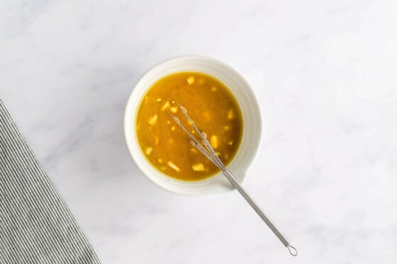 Lemon juice, vinegar, maple syrup, dijon, garlic, salt, pepper and oil whisked together in a ramekin.