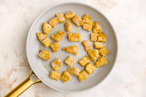 Baked chicken in a skillet to crisp up.
