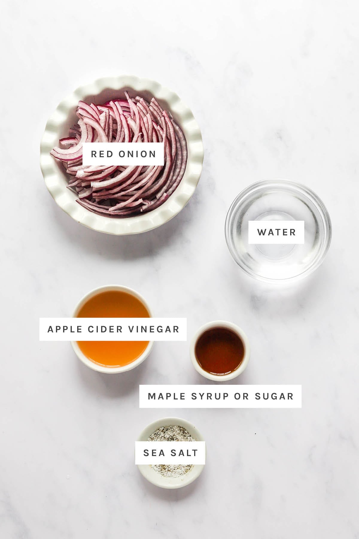 Ingredients used for pickled onions include: red onions, water, maple syrup, vinegar, and sea salt.