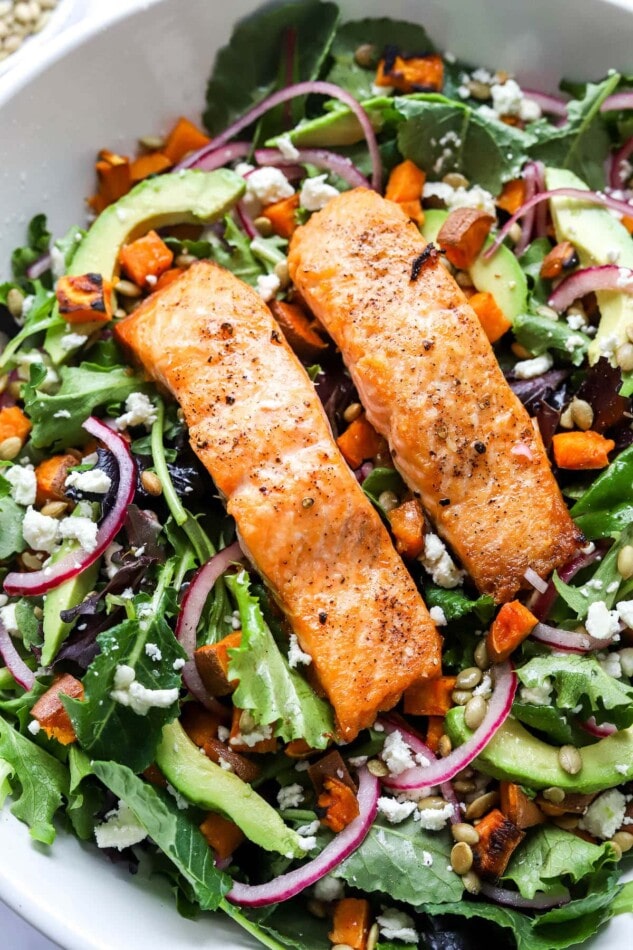 PIN THIS --> Seared Salmon Salad Two filets of salmon over a bed of superfood greens.