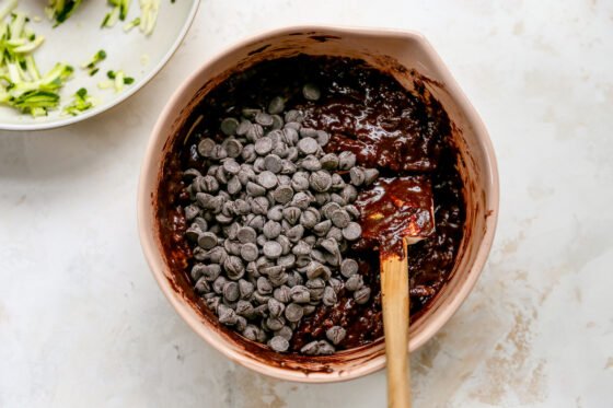 Chocolate chips added to brownie batter.