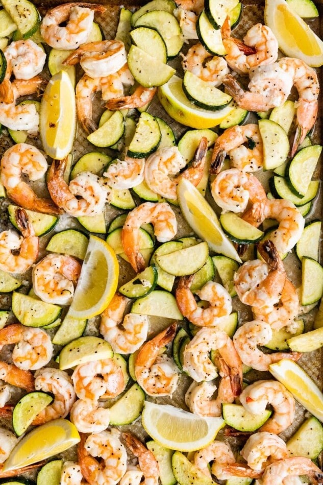 A close up of shrimp scampi on a sheet pan.