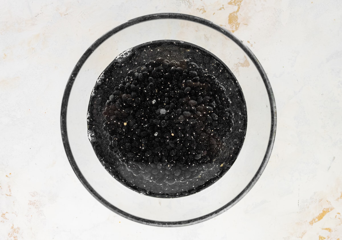 Black beans soaking in water overnight.