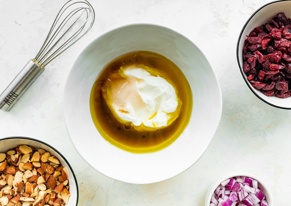 Greek yogurt, vinegar, oil, maple syrup and salt in a small mixing bowl.