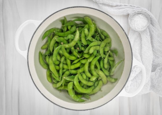Edamame cooking in boiling water.