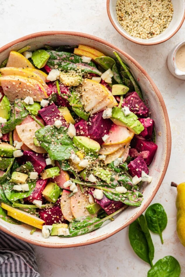 Pear and Beet Salad with a Ginger Hemp Dressing A salad bowl containing pear and beet salad.