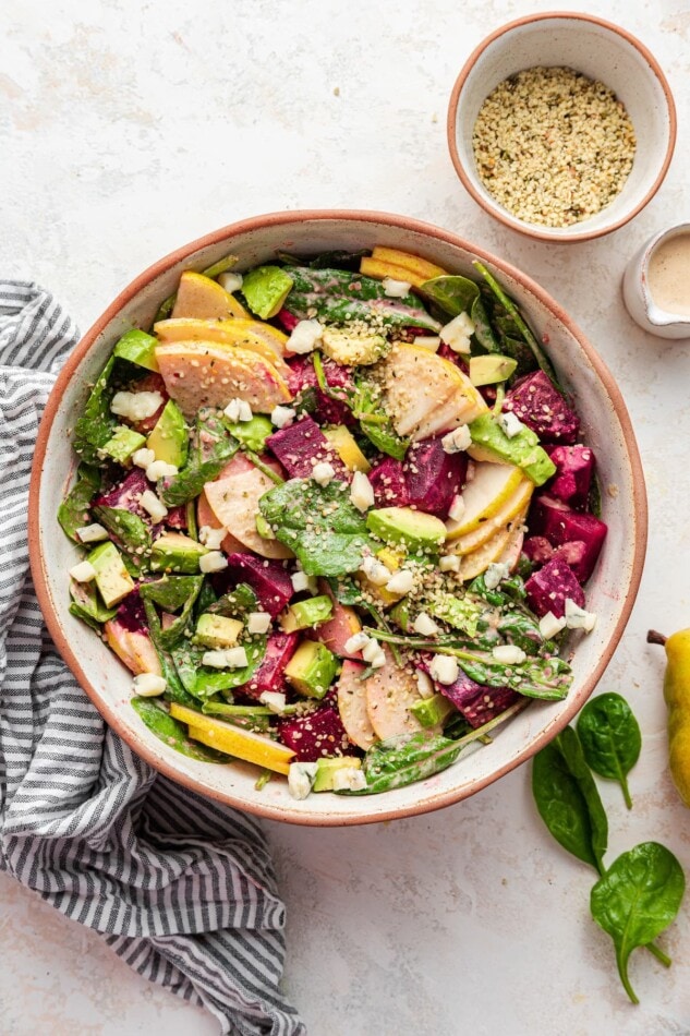 Pear and beet salad in a salad bowl.