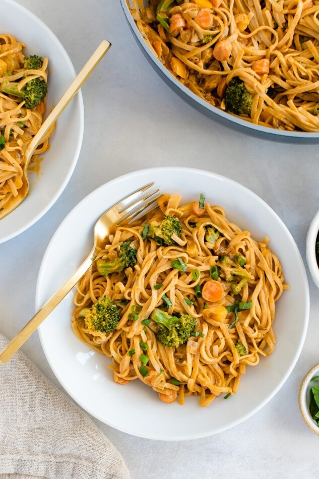 Serving bowls containing coconut curry SunButter noodles.