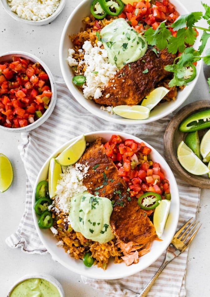Two salmon burrito bowls.
