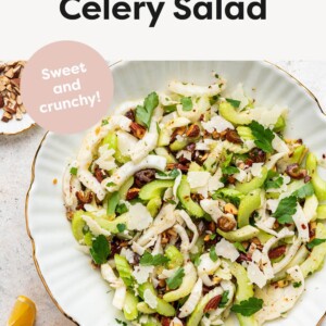 Close up image of fennel and celery salad in white serving bowl.