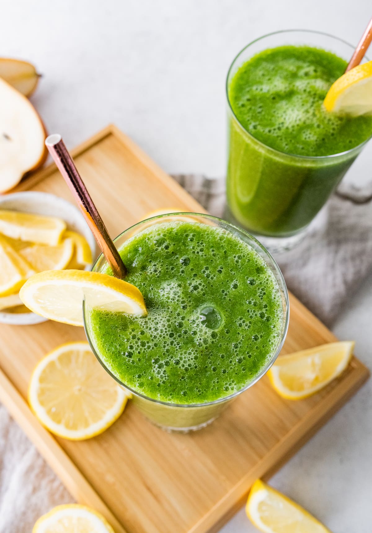 Green Lemonade smoothie Overhead view of two green lemonade smoothies in glasses.