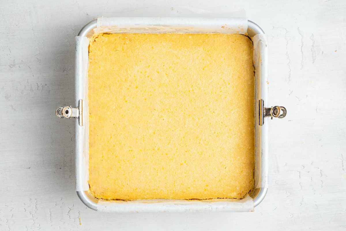 Cooked lemon bars in pan.