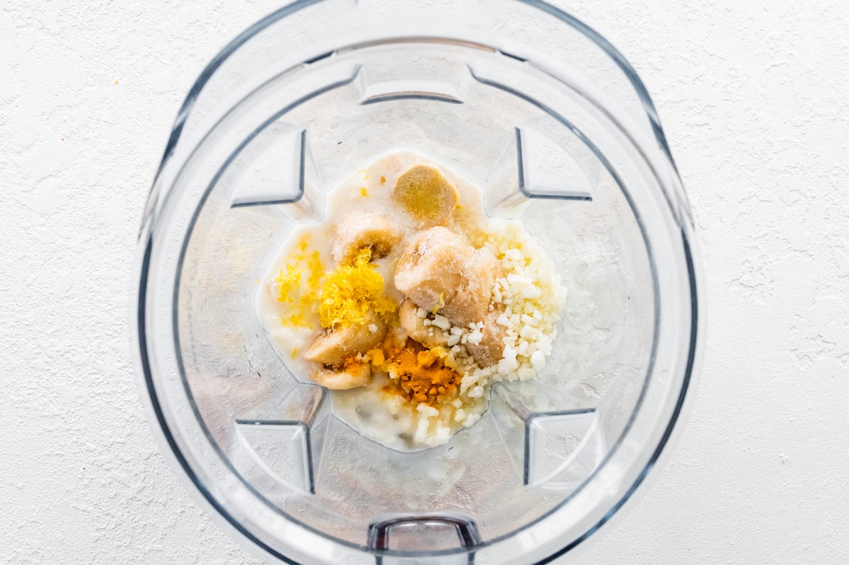 Lemon smoothie ingredients in a blender.