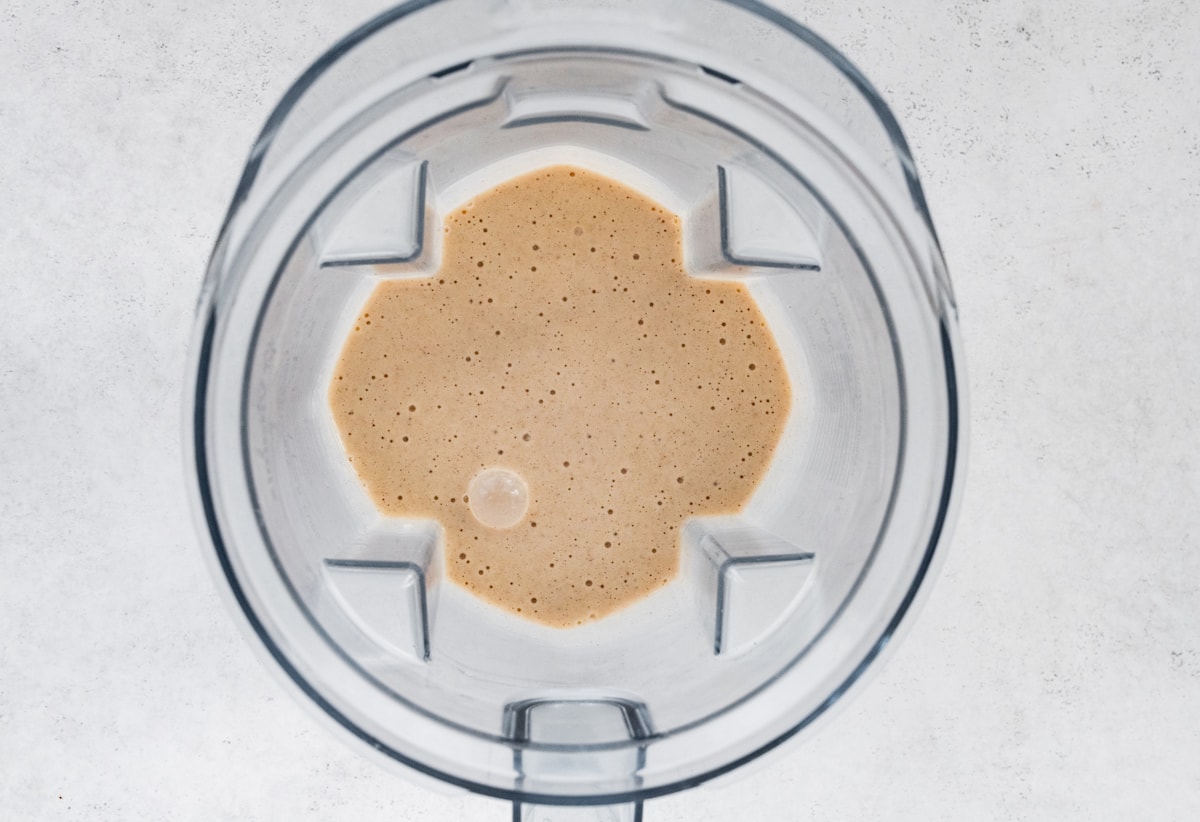 Blended tahini smoothie in blender.