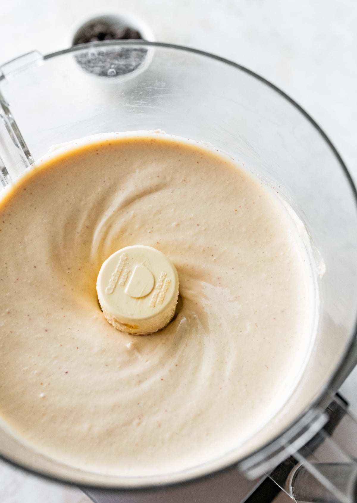 Blended cottage cheese ice cream in a food processor.