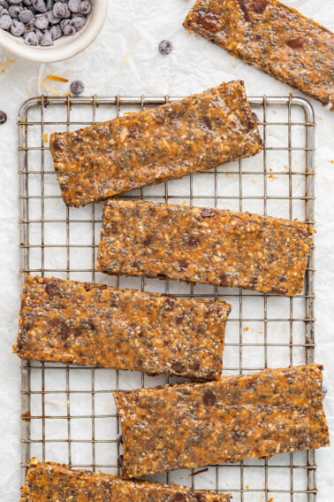 Coconut chia bars on a wire rack.