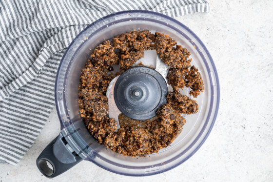 Coconut chia bar mixture in a food processor.