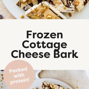 Frozen cottage cheese bark with dark chocolate and granola cut into squares and served on a white plate.