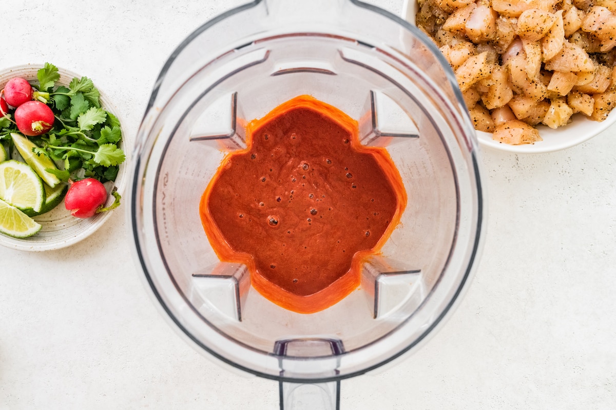 Blended chile peppers with garlic and other spices in a blender.