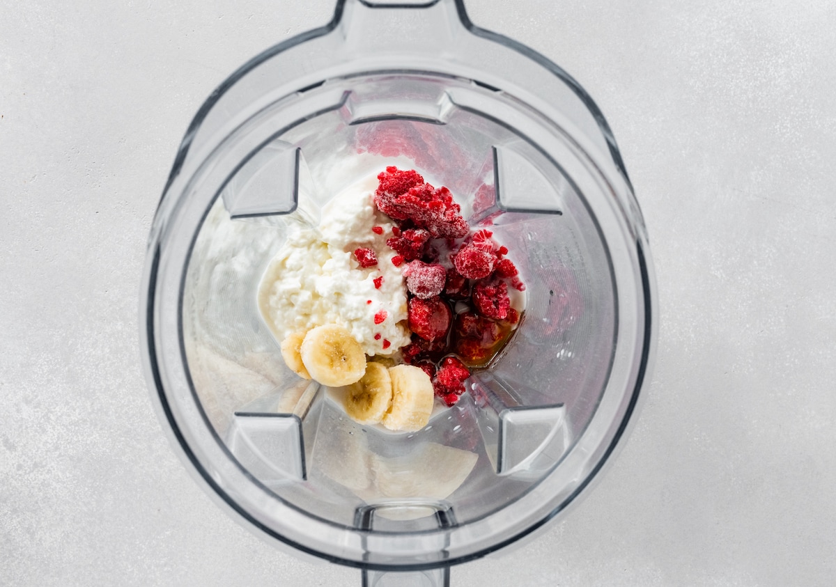 Ingredients for the cottage cheese smoothie in a Vitamix blender.