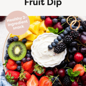 Photo of fruit on a platter with a bowl of Yogurt Fruit Dip.