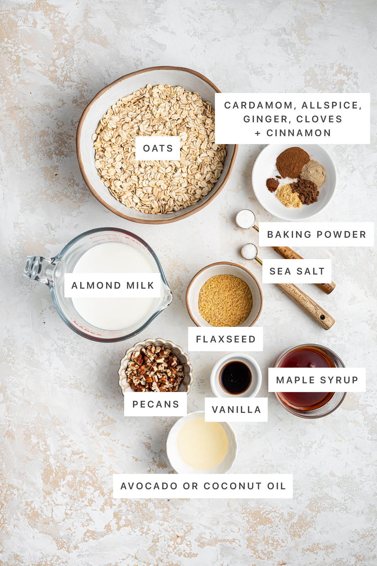 HEALTHY Baked Chai Oatmeal Cups. You’ll love how easy they are to make and the cozy chai flavor. Ingredients measured out to make Chai Baked Oatmeal Cups: oats, cardamom, allspice, ginger, cloves, cinnamon, baking powder, sea salt, almond milk, flaxseed, pecans, vanilla, maple syrup and coconut/avocado oil.