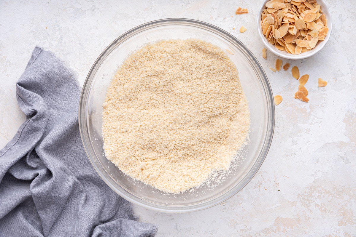 A glass bowl containing the dry ingredients used for an almond cake.