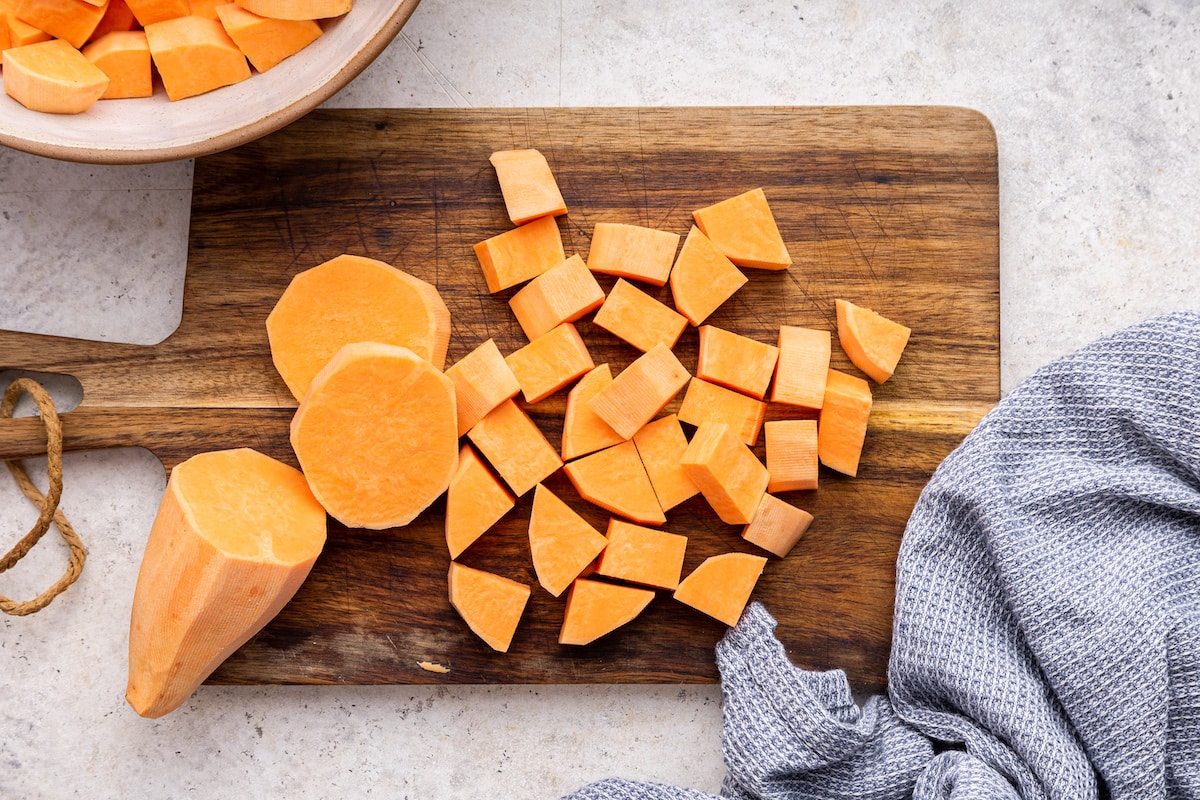 Cubed sweet potato on a cutting board.