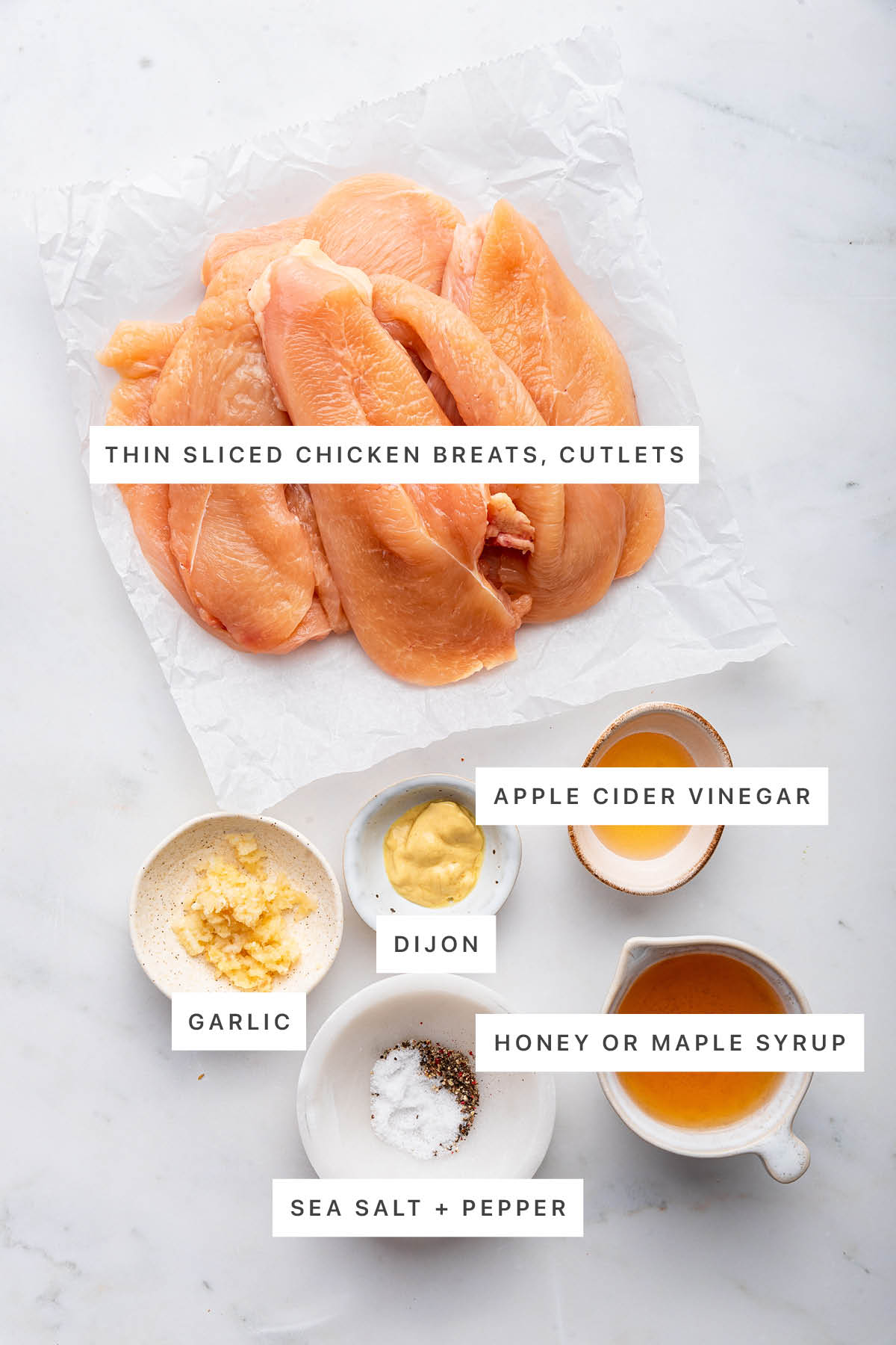 Ingredients for air fryer chicken cutlets include: chicken breasts, garlic, dijon mustard, vinegar, honey, salt, and pepper.