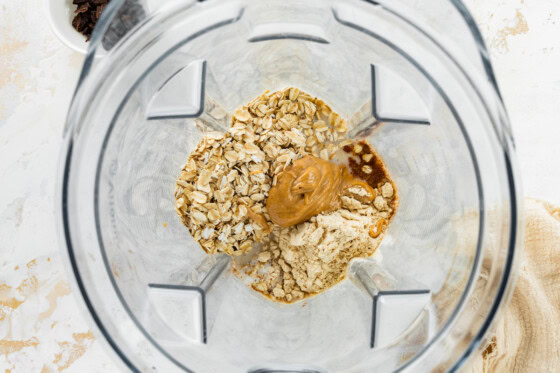 Oats and nut butter in a blender.