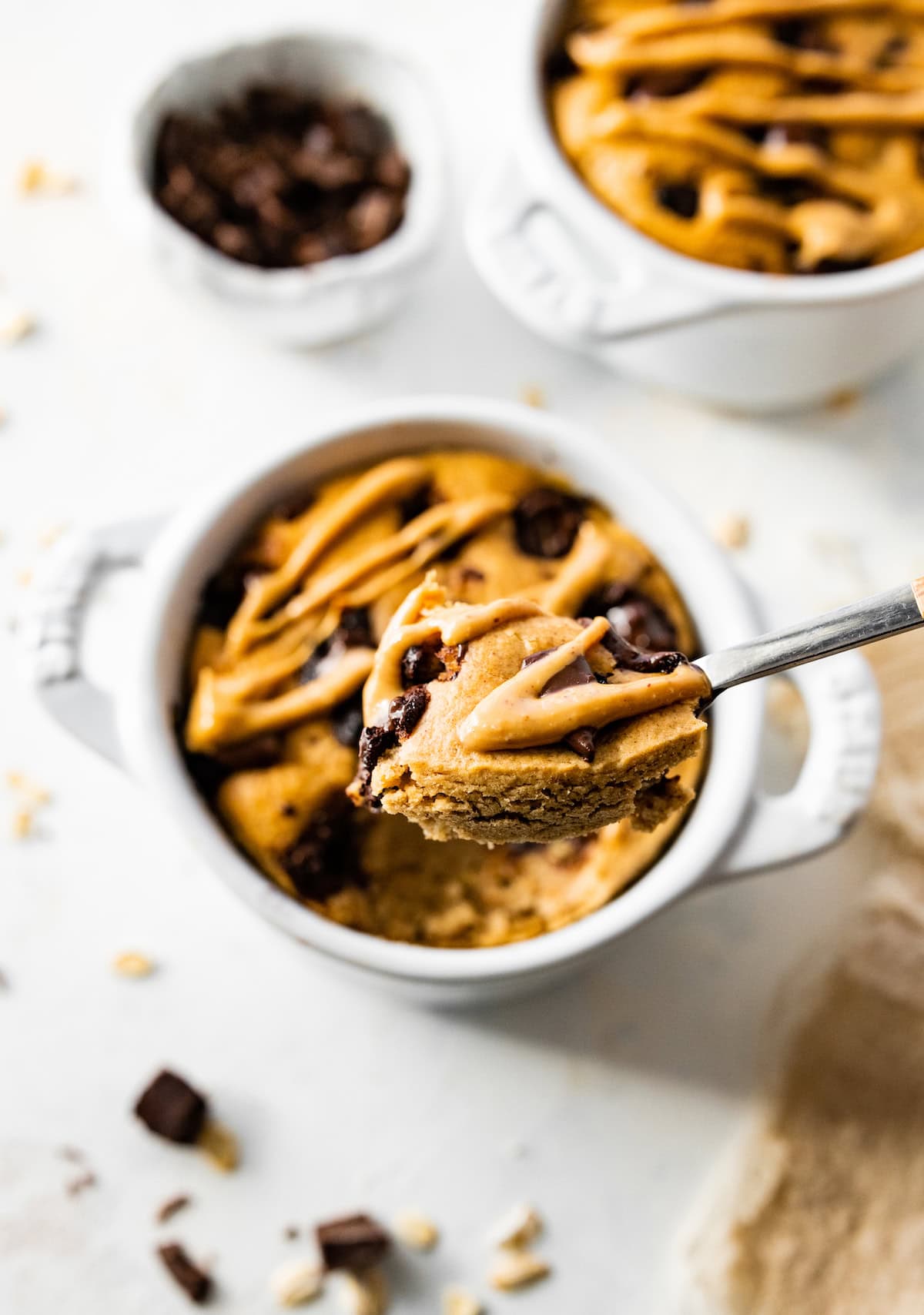 A spoon with a bite size piece of air fried baked oatmeal.