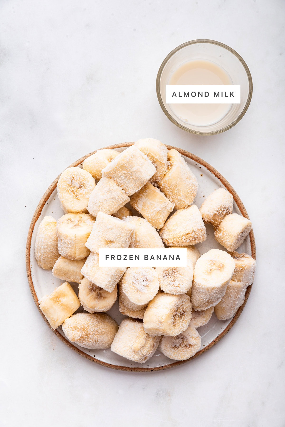Ingredients measured out to make One Ingredient Banana Ice Cream: almond milk and frozen banana.