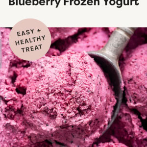 Ice cream scooper taking a scoop of 3-Ingredient Blueberry Frozen Yogurt.