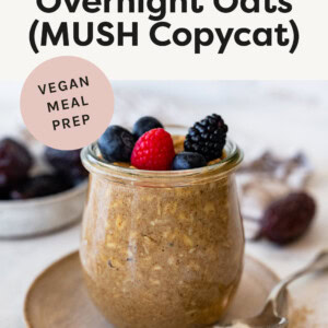Vanilla overnight oats in a glass jar, topped with berries.