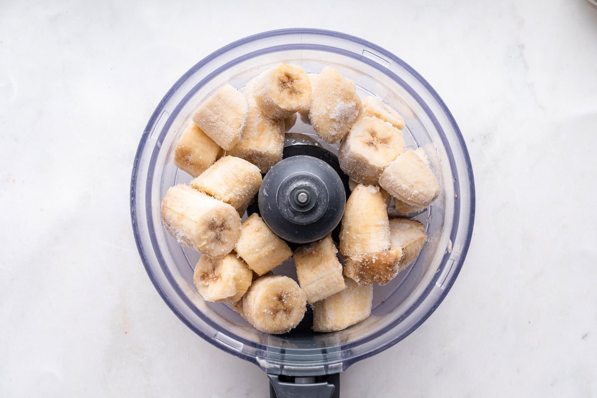 Frozen bananas in a food processor.