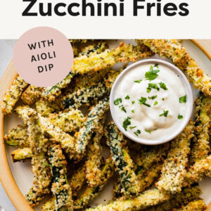Plate of Crispy Baked Zucchini Fries with aioli dipping sauce.