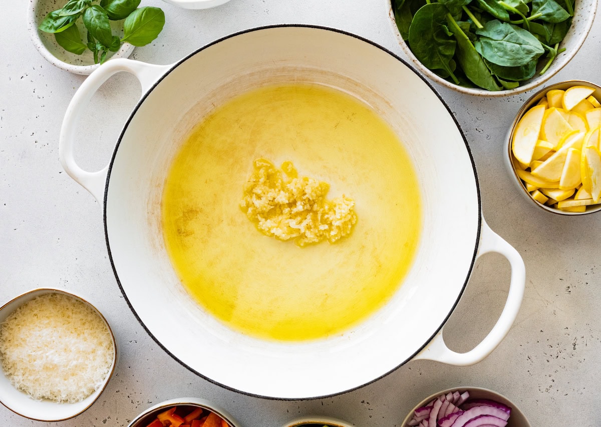 Olive oil and sauteed garlic in a large pot.