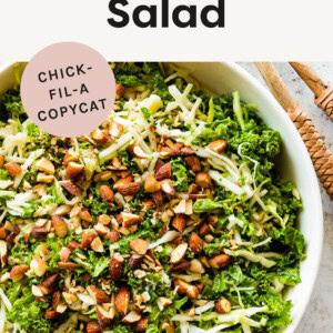 Kale salad topped with almonds in a serving bowl.