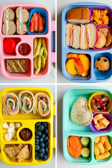 Four bento style kid's lunch boxes filled with different snacks, sandwiches and fruits.