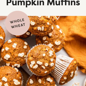 Healthy Pumpkin Muffins topped with oats on a counter top.
