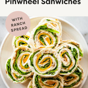 Turkey Pinwheel Sandwiches piled on a plate.