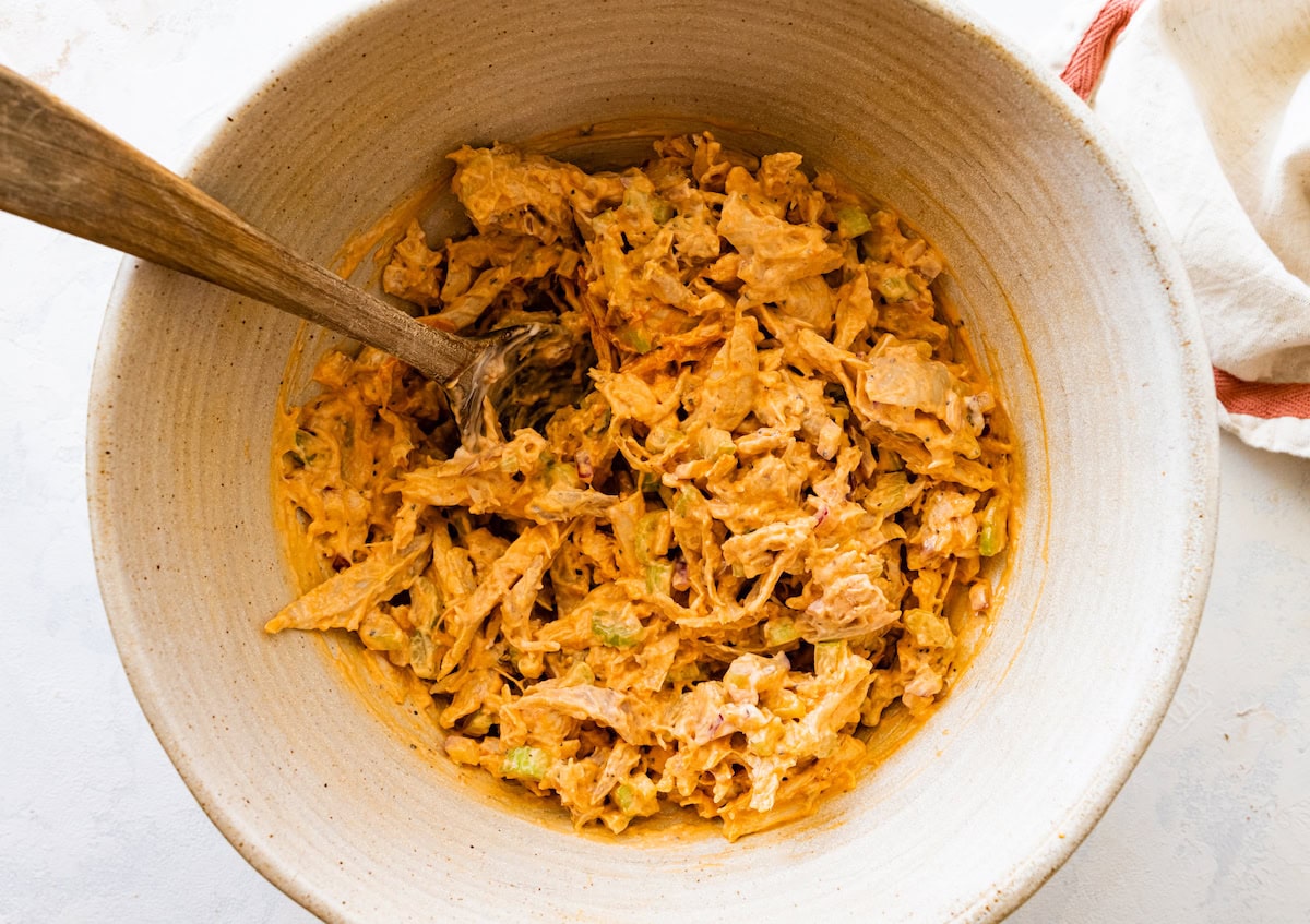 A large bowl of buffalo chicken salad.