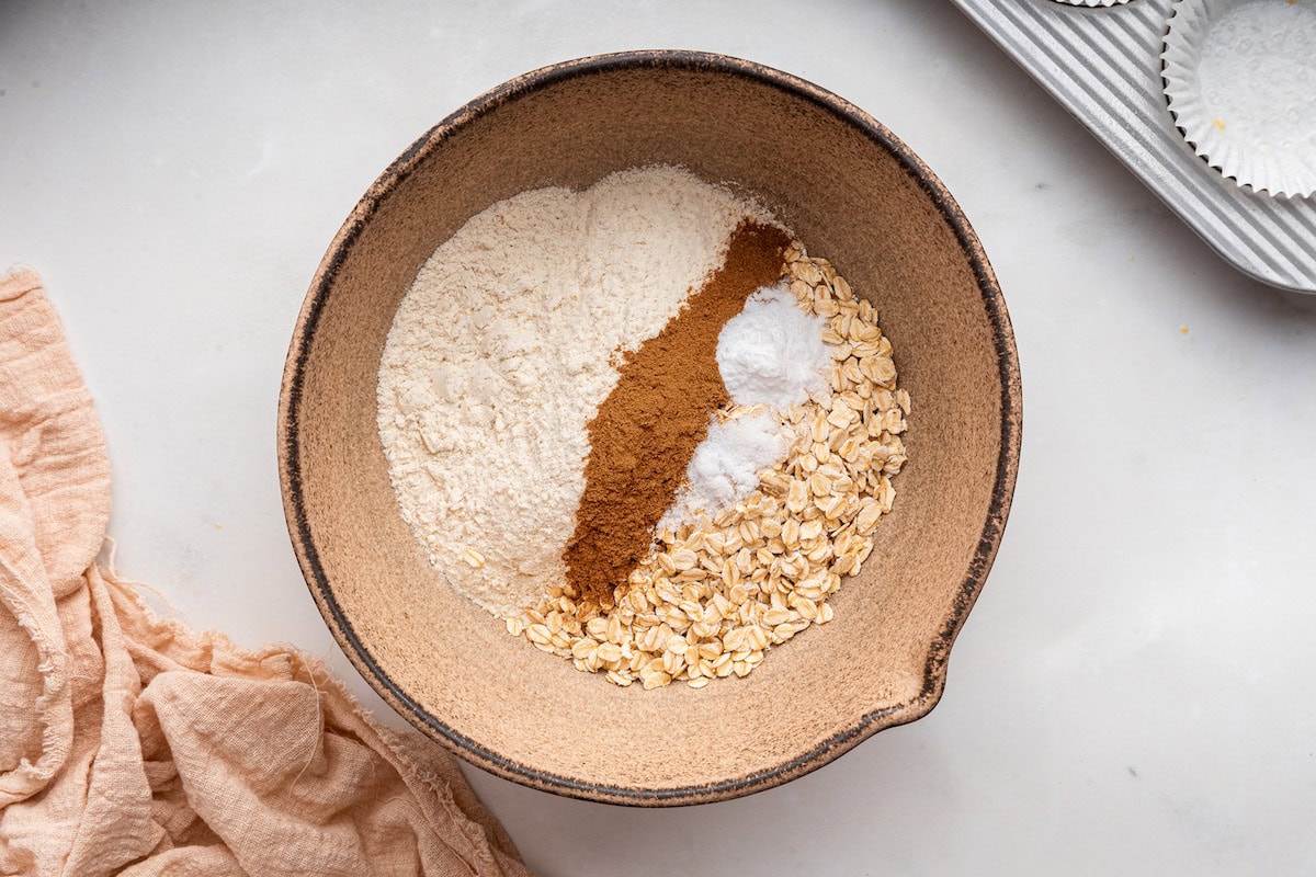 A large bowl of all the dry ingredients used for pumpkin muffins.