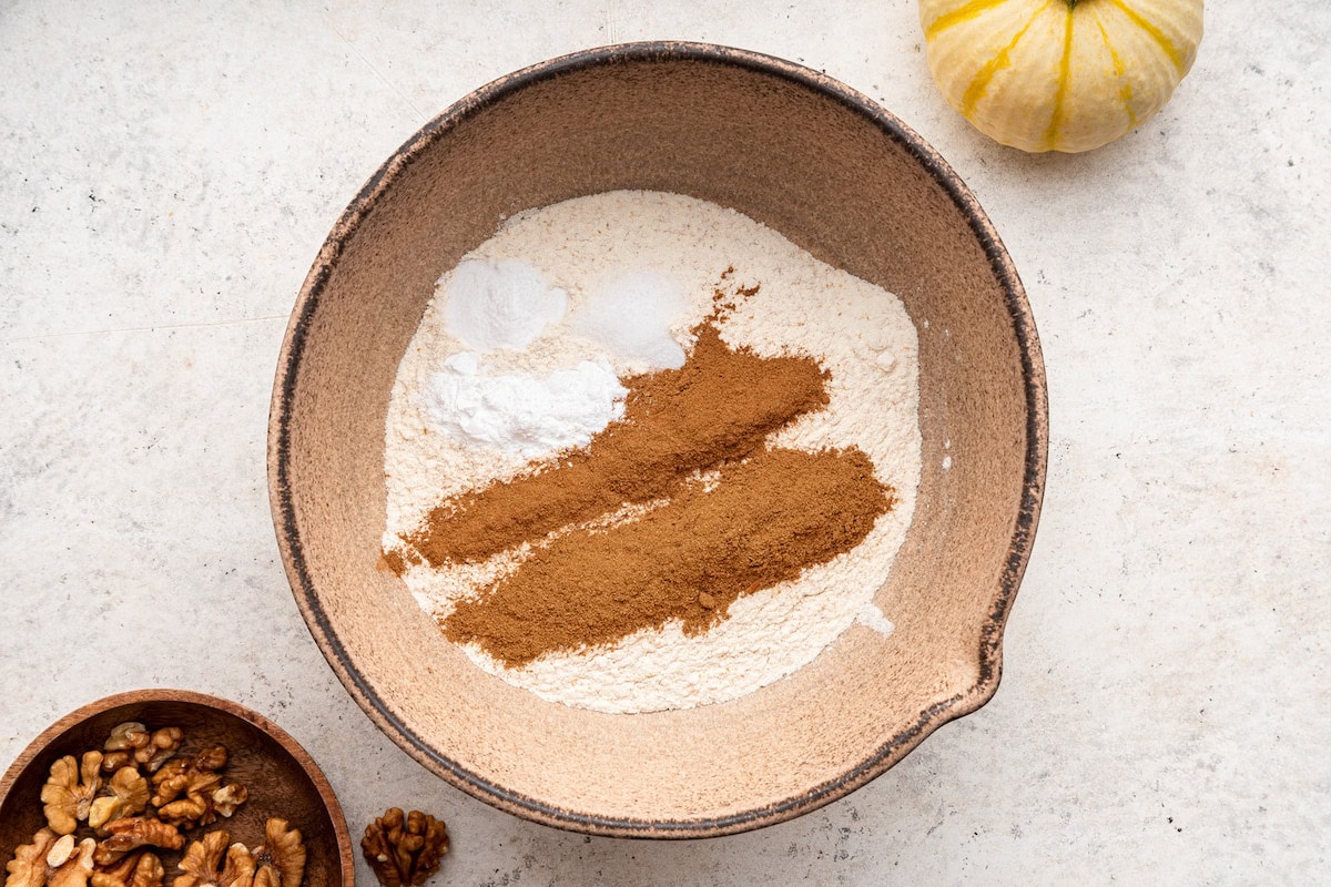 Dry ingredients used for pumpkin banana bread in a large bowl.