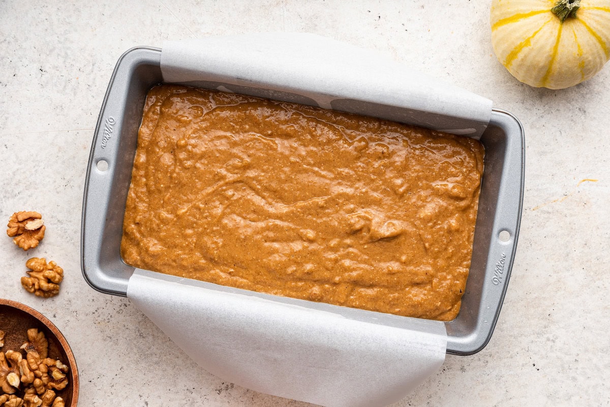 The dough of pumpkin banana bread in a bread pan before being baked.