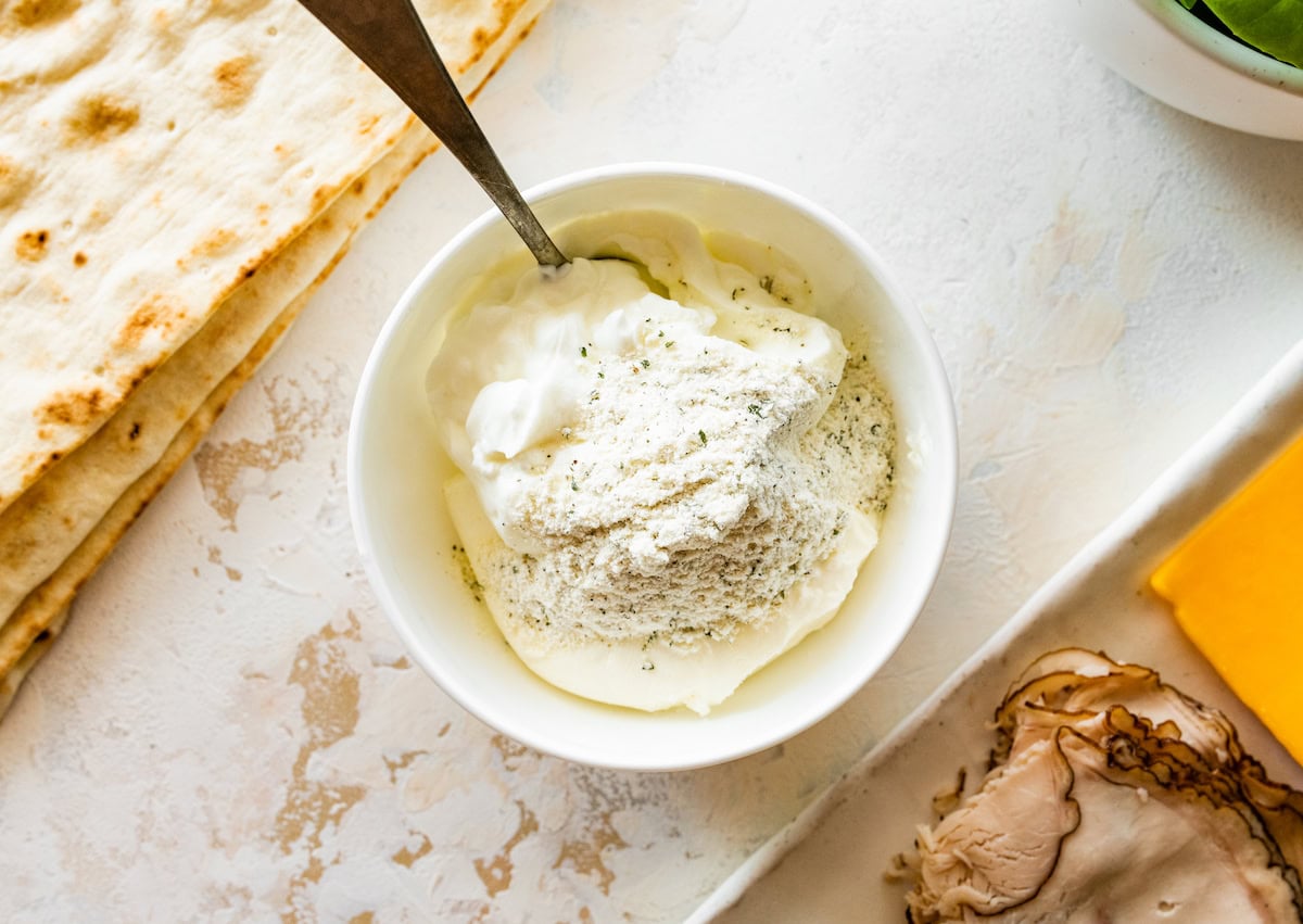 A cream cheese, yogurt, and ranch seasoning mixture in a small bowl.
