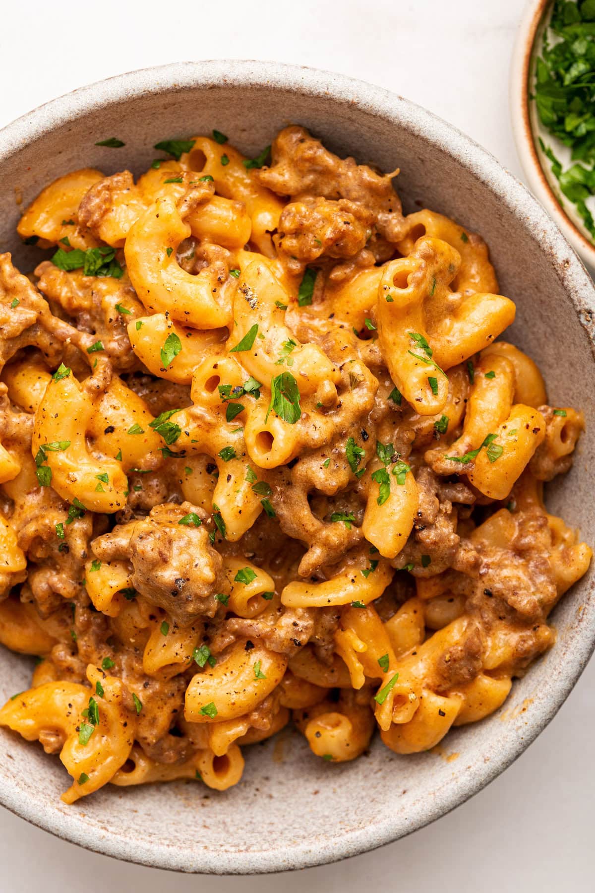 A serving of healthy hamburger helper with macaroni noodles and ground beef in a bowl.